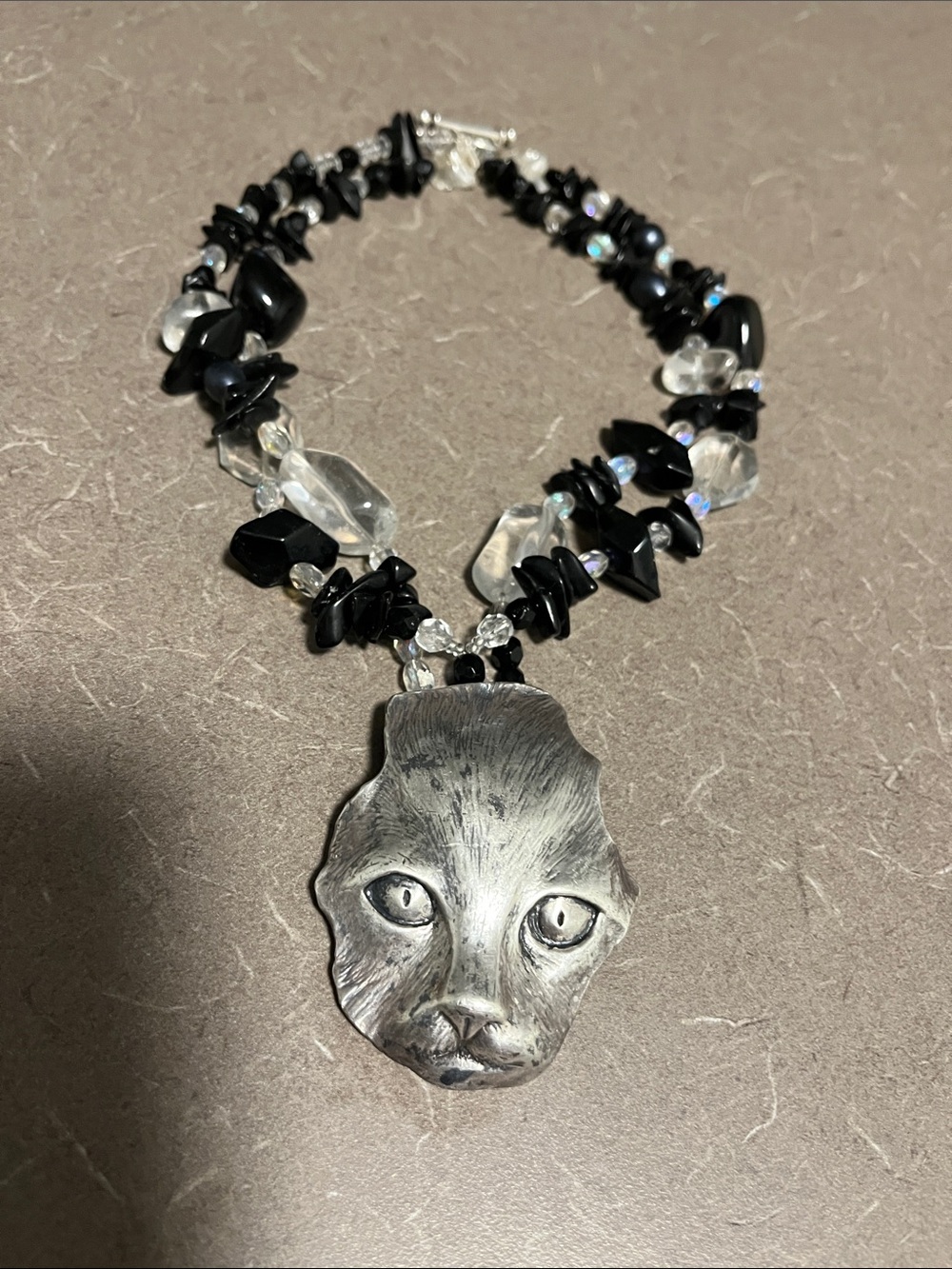Vtg Handcrafted Silver tone cat pendant with multi strand black and clear beads